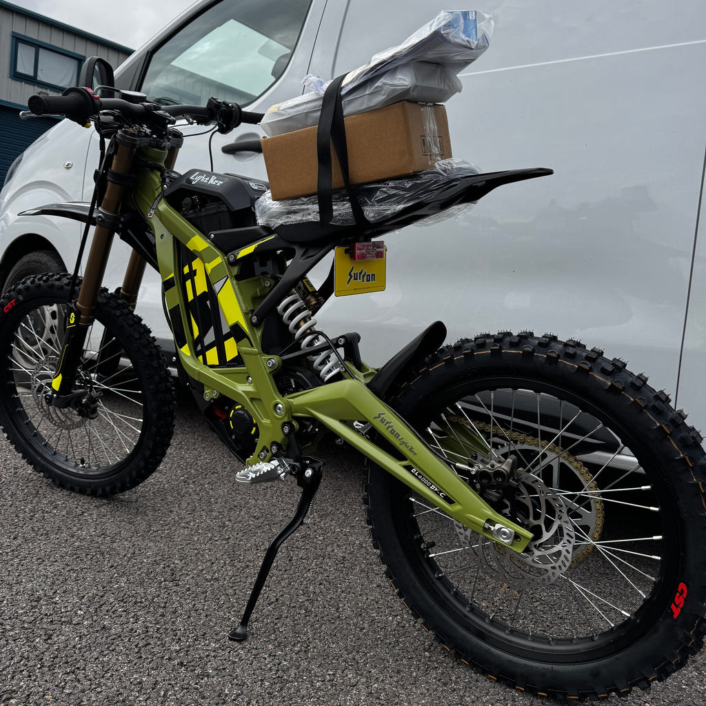 2026 Sur-Ron Light Bee X in Green, rear three-quarter view with rear shock and swingarm